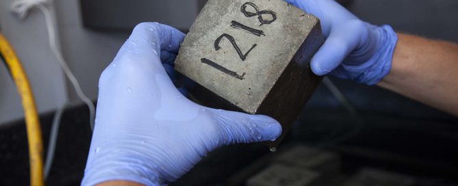 man holding concrete material